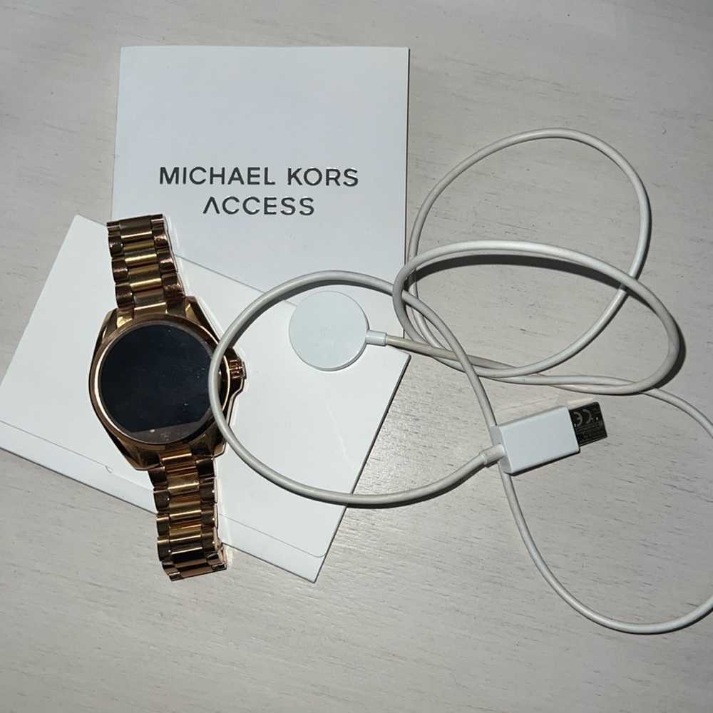 Michael kors smart watch with charger and paperwork